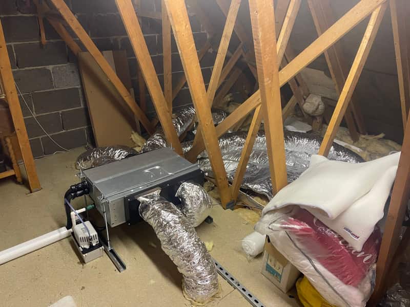 Ducted air conditioning installation, Newcastle upon Tyne Ducted air conditioning unit being installed in a loft in Newcastle upon Tyne
