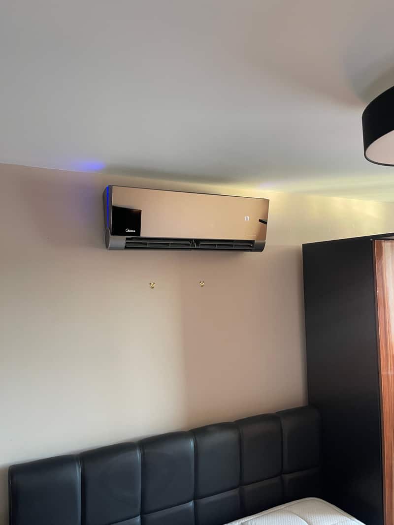 Designer air conditioner, Newcastle upon Tyne Mirror-finish designer air conditioner in a bedroom in Newcastle upon Tyne