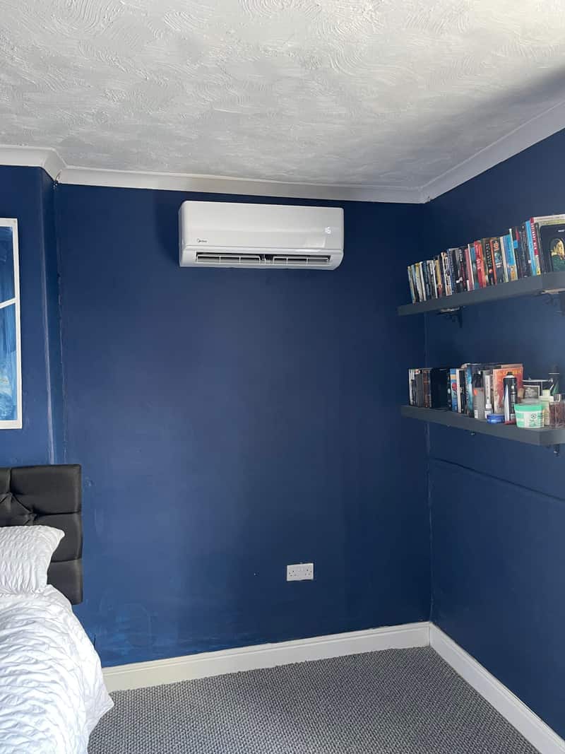 Residential air conditioning installation, Newcastle upon Tyne Residential air conditioning unit in a navy blue bedroom in Newcastle upon Tyne